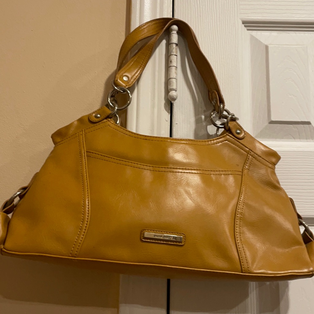 Leather Small Bag Has Very Small Stain Inside But Never Used